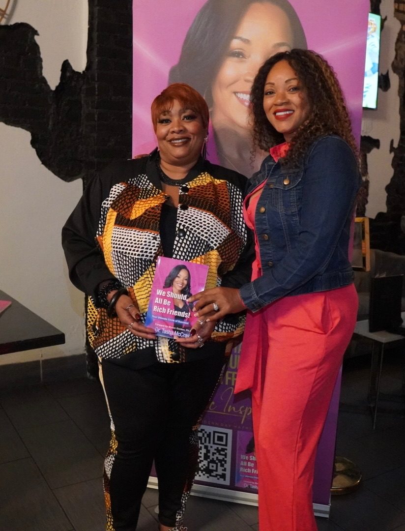 A reader holding her copy with Dr. TMac